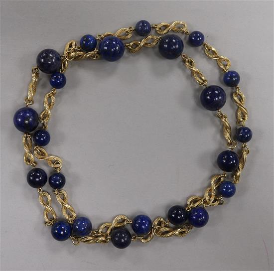 A yellow metal fancy link and lapis lazuli bead necklace, 83cm.